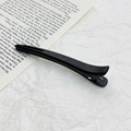 Matte black seamless hair clip for styling and makeup on a book backdrop - 11.8cm / Black