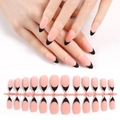 Almond-shaped French press-on nails with nude pink base and black tips shown on a model - French Black Tip Long Almond Matte (HTMC-MP02)
