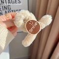 Creamy beige plush hair claw clip featuring a brown smiley face and smile lettering - Smile Plush Clip / Beige
