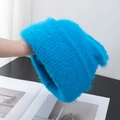 Detail of royal blue fluffy knit beanie showing soft mohair texture and warm thick yarn - Stretchy / Lake Blue