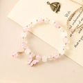 Pink and white moonstone crystal bracelet featuring a delicate butterfly charm - Pink Crackle + White Bodhi Pink Butterfly (K3512)