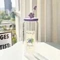 Glass straw cup with purple lid and flower dust cap featuring a cartoon grape design - Grape + Lid + Straw + Dust Cap