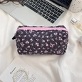 Quilted floral makeup bag with pink zipper and delicate flower pattern on black fabric - Black with Pink Floral