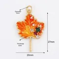 Maple leaf charm in golden finish with orange gradient enamel and zircon accents - Orange Enamel Maple Leaf / Orange