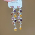 Detail of long tassel earrings with multicolored heart crystals in gold prong settings - Multicolor Heart Tassel (HE27141)