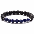 Detailed macro view of natural black lava rock beads and faceted blue lapis lazuli stones - Lapis Lazuli