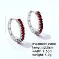 Detailed view of silver hoop earrings with red zircon stones measuring 2.5cm by 2.5cm - Red Zirconia