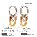 Three-link stainless steel drop earrings featuring silver loops and a gold oval ring - Gold and Silver