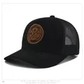Close-up of black trucker hat mesh and brown leather patch with Enjoy Life engraving - Head Circumference 55-59cm / Black