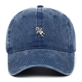 Vintage washed blue cotton baseball cap with embroidered astronaut on a white background - Navy Blue