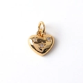 Macro shot of gold-plated heart pendant with star-set cubic zirconia and polished finish - 05-Heart with Stars