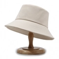 Classic cream beige cotton bucket hat for men and women on a wooden display stand - One Size / Light Beige