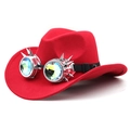 Red western cowboy hat with steampunk spiked kaleidoscope goggles on a plain background - Red