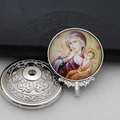 Detailed macro view of an Orthodox silver metal icon featuring Mary and Child on a glass face - Silver-17 (Virgin Mary & Child Icon)