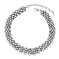 Close-up of interlocking silver-tone chain necklace with lobster clasp and extender - Necklace / Steel