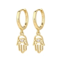 Detailed macro view of S925 sterling silver stamp on golden Hamsa Hand charm earrings - Hamsa Hand - Gold