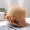 Detailed view of camel knitted bucket hat featuring elegant side flower and ribbon bow - Flower / Khaki