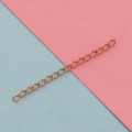 Detail of rose gold stainless steel extension chain with oval links on a pastel background - 5cm / Rose Gold