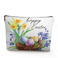 Close-up of linen cosmetic bag featuring watercolor Easter flowers and eggs design - Easter Basket Bunny