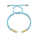 Adjustable light blue woven bracelet with gold beads and pendant ring detail - Light Blue