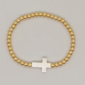 Handmade beaded bracelet featuring golden metal beads and a white cross pearl charm - White Shell Cross