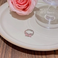 Macro shot of silver ring with pink zircon butterfly heart-shaped stone and side diamonds - Silver - Pink CZ Bowknot