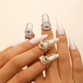 Close-up of gold and silver evil eye nail rings with white crystals and black center stone - Nail Ring / 4 Pcs Pack / Multicolor Combo