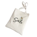 Off-white canvas tote bag featuring a black Smile print and daisy flower design - Daisy-Smile