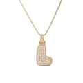 Close-up of golden balloon letter L pendant with cubic zirconia on a box chain - Letter L