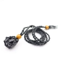 Detail of hand-woven black mesh necklace with polished stone and wooden beads - Obsidian With Black Mesh Bag