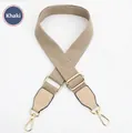 Detail view of khaki adjustable canvas bag strap with golden metal swivel hooks - Khaki Strap-Apricot Leather / Light Gold Buckle