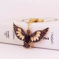 Portachiavi vintage a forma di aquila dorata con cristalli su libro decorativo - Oro Con Strass Nero