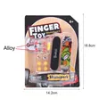 Detailed macro view of 96mm finger skateboard set with replacement wheels and mini tools - 6805-2 Set