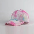 Detail view of colorful tie-dye patterns on a cotton six-panel baseball cap for sun protection - Adjustable / Pink White