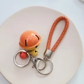 Orange braided leather keychain with colorful cartoon bells and silver metal clasp - Yellow & Orange