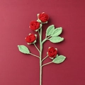 Flat lay of four handmade red crochet roses and six green leaves on a dark red background - Finished Bubble Rose (4 Heads Wine Red)