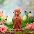 Cute Buddhist monk car ornament in orange robe with hands in prayer position - Prayer Pose (Small Size)