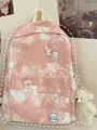 Zaino in tela tie-dye rosa e bianco per donna con spille a fumetto e ciondoli in peluche - Senza Ciondolo / Rosa