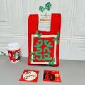 Red knitted tote bag with green abstract geometric patterns and wide shoulder straps - Red with Green Accents