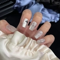 Close-up of handmade press-on nails with silver glitter cat and star patterns - By1655 / Glue Type