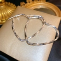 Silver-tone heart-shaped twisted hoop earrings with a polished metallic finish - E4983 Silver Twisted Hearts
