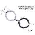 Close-up of heart-shaped magnetic buckle connecting black and white marble bead bracelets - Black White Textured Stone Style (WB0654-10)