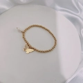 Detail of gold beaded bracelet with hollow butterfly charm and white drop pearl - Gold-Semi-hollow Butterfly
