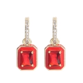 Detail of 18K gold earrings featuring rectangular red gemstones and small clear zircons - Red