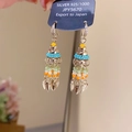 Detail of colorful beaded tassel earrings with silver leaves on brand display tag - Style 12# Ear Hook-Gold-Multicolor