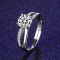 Macro shot of a four-prong moissanite ring with split shank and pavé accents on blue background - Adjustable / Style 25 Split Shank Ring (1 Carat)