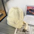 Pale yellow canvas backpack for women featuring a minimalist design and front zipper pocket - Off White