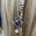 Silver sunflower braid ring with pink bead pendant worn on golden hair braid detail - Sun Flower Pink Bead