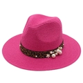 Detail of rose red straw fedora featuring leopard print band and pearl flower accents - Rose Red