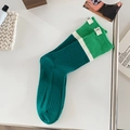 Striped knit skateboard socks in dark and light green with a signature white T letter tag - One Size / Dark Green